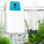 A white aquarium air pump is pumping oxygen into the fish tank. Bubbles are constantly appearing in the fish tank.