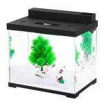 A small fish tank with a Christmas tree in it.