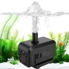 a balck submersible aquarium water pump is working in the tank.