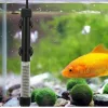 A fish and a heater in an aquarium.