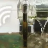 A noisy aquarium hob filter is working.